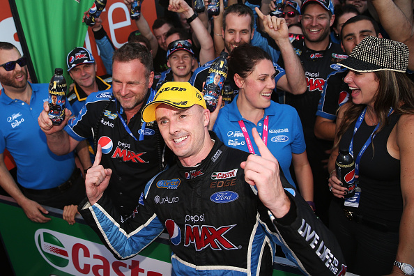 SYDNEY, AUSTRALIA - DECEMBER 05:  Mark Winterbottom driver of the #5 Pepsi Max Crew Ford celebrates with his crew after claiming his maiden V8 Supercar Championship Series title after finishing third in race #35 for the Sydney 500, which is part of the V8 Supercar Championship Series at Sydney Olympic Park Street Circuit on December 5, 2015 in Sydney, Australia.  (Photo by Brendon Thorne/Getty Images)