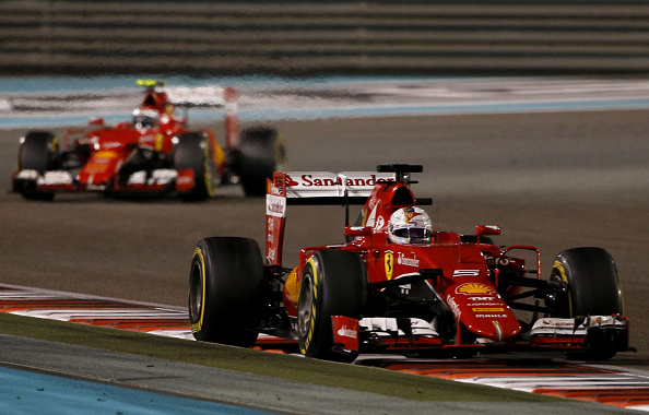 Ferrari's German driver Sebastian Vettel (R) and Ferrari's Finnish driver  Kimi Raikkonen race during the Abu Dhabi Formula One Grand Prix at the Yas Marina circuit on November 29, 2015.    AFP PHOTO / KARIM SAHIB / AFP / ANDREJ ISAKOVIC        (Photo credit should read ANDREJ ISAKOVIC/AFP/Getty Images)